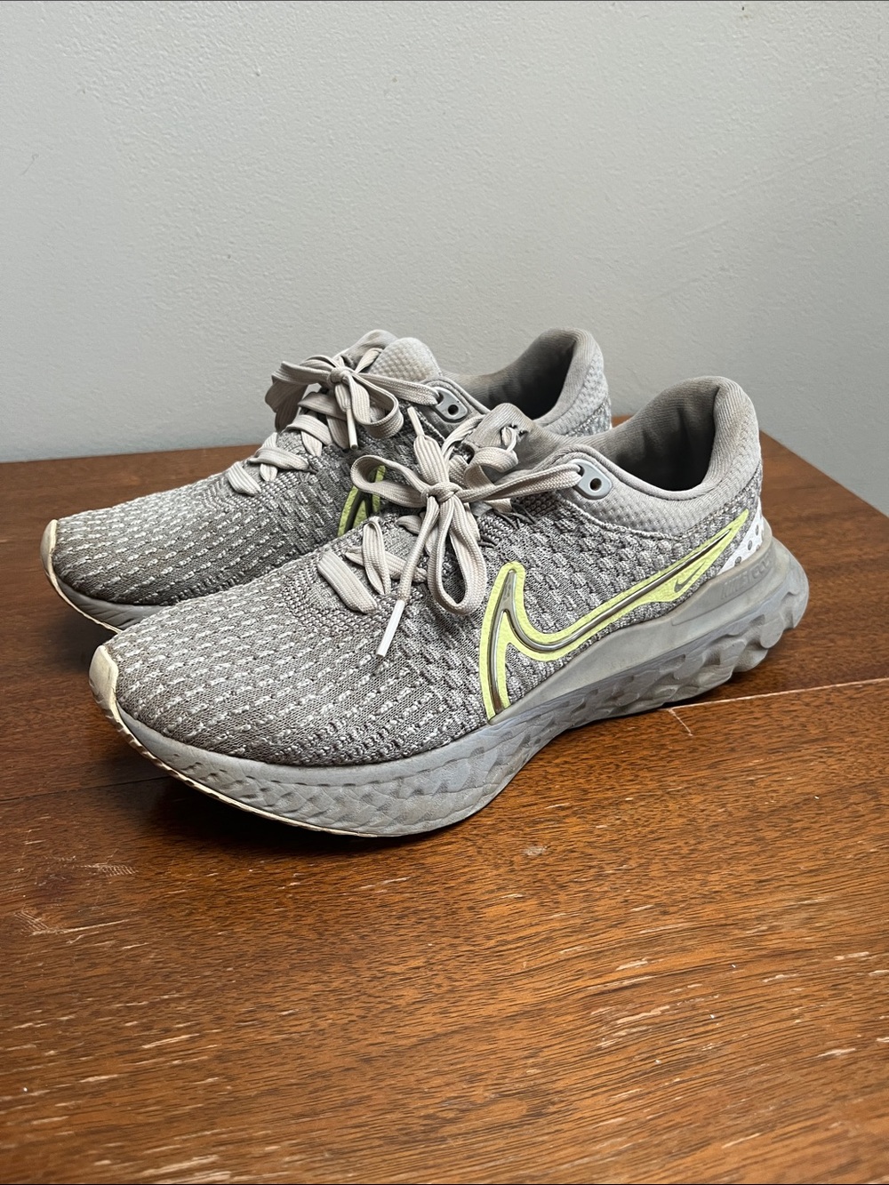 Nike Light Gray Knit Running Shoes with Neon Yellow Swoosh